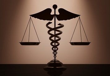 Medical Caduceus Symbol as Scales with backlight over Wall in dark room. 3d Rendering