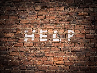 The Word Help On A Vintage Red Brick Wall