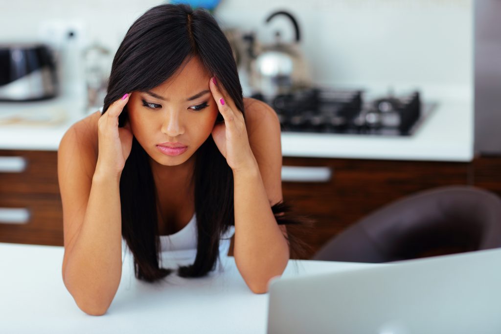 Stressed and homesick Asian woman. 