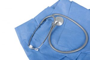 Doctor's uniform and stethoscope isolated in a white backgroud
