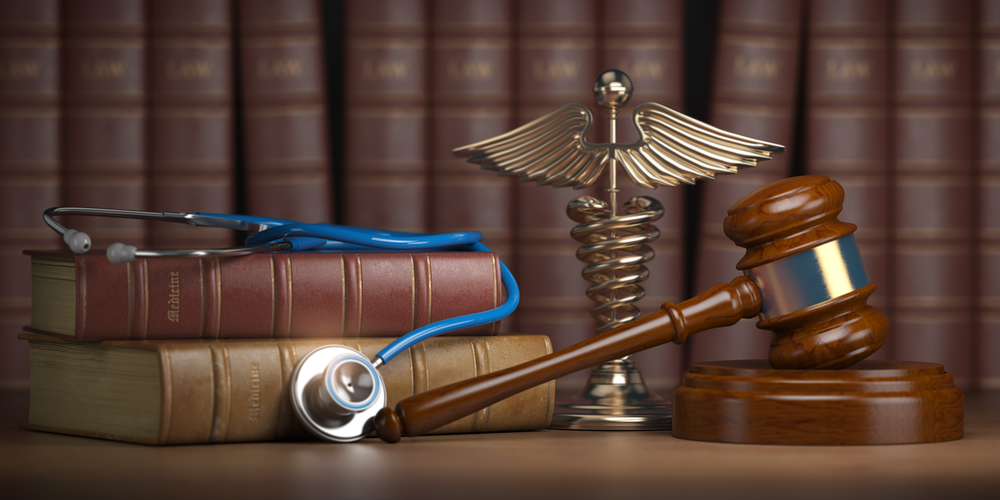Gavel, stethoscope and caduceus sign on books background. Mediicine laws and legal, medical jurisprudence. 3d illustration