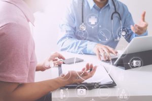 A medical professional consulting with a client