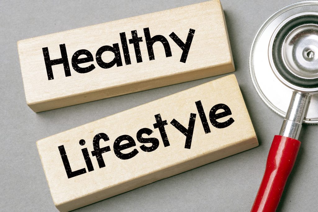 A wooden block sign that says Healthy Lifestyle.