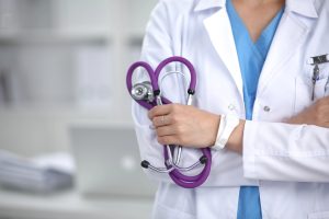 doctor holding stethoscope