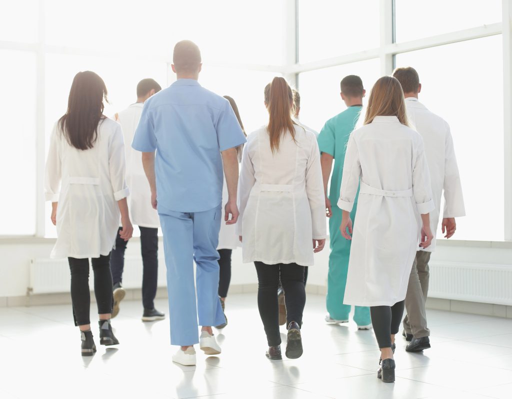 rear-view-doctors-of-the-medical-center-walking-in-the-corridor