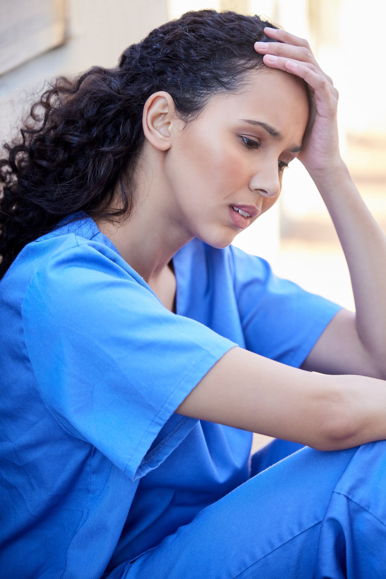 Outdoor, female nurse and stress, tired and mental health of medical employee outside. Exhausted, healthcare worker or woman with migraine or burnout, anxiety and overworked pressure in balcony.