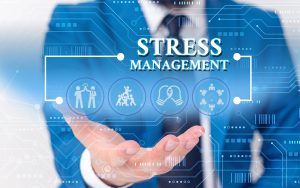 Writing note showing Stress Management Consultant. Business concept for method of limiting stress and its effects by learning ways Male wear formal work suit presenting presentation smart device