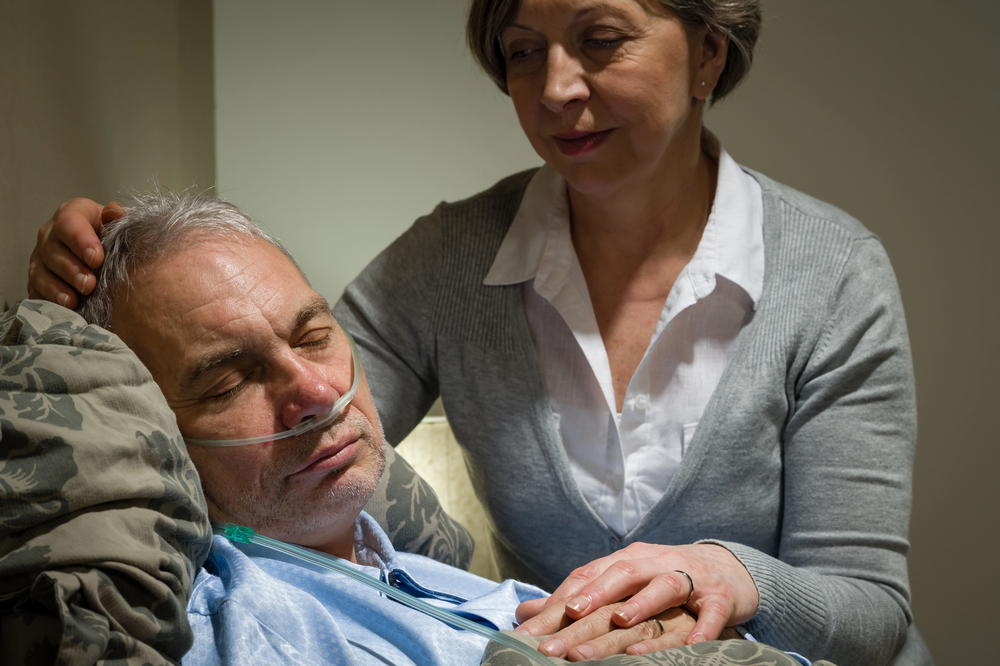 Woman caring for dying husband