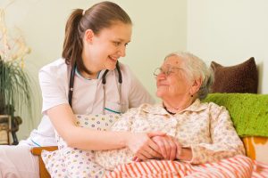 A holistic nurse helping a patient