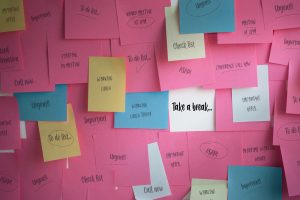 A board with various postIt notes about stressful tasks that need done. In the middle it says Take a Break. 