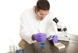 A forensic nursing specialist working in a lab. 