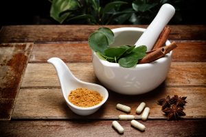 Holistic Herbs in a dish ready to be ground up.