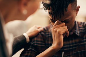 Man crying while in therapy