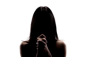 Woman praying intently