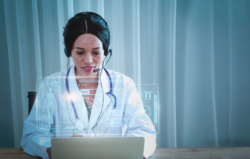 Telehealth nurse working at a computer