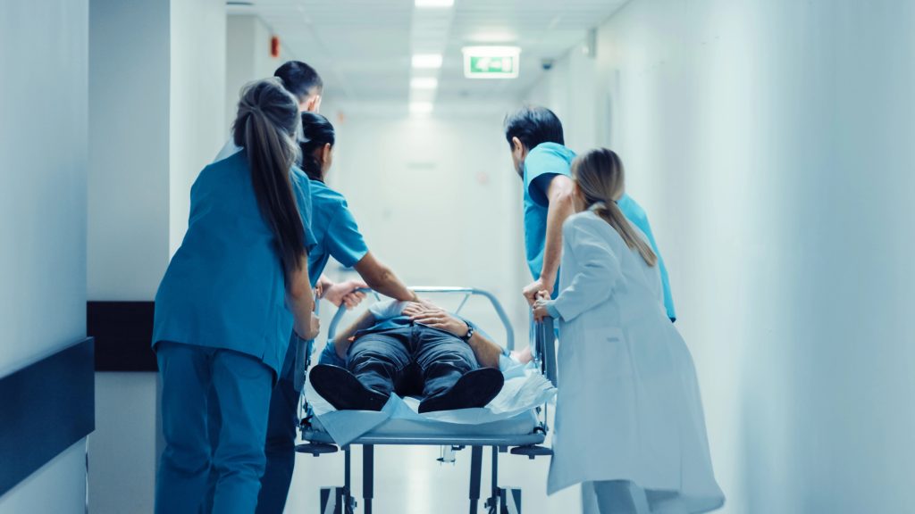 ER doctors rushing a patient into a hospital room