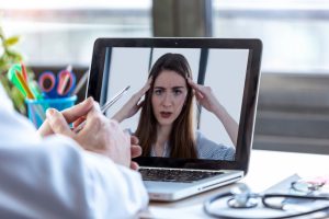 patient on a telehealth call talking to a nurse