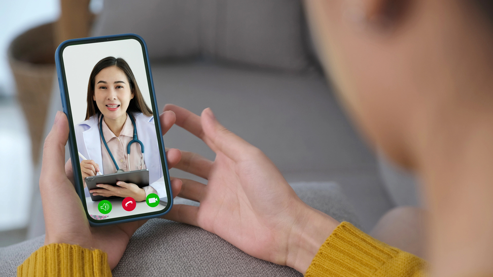 patient seeing a nurse on their cellphone via telehealth