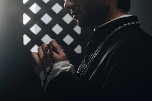 A priest taking confession