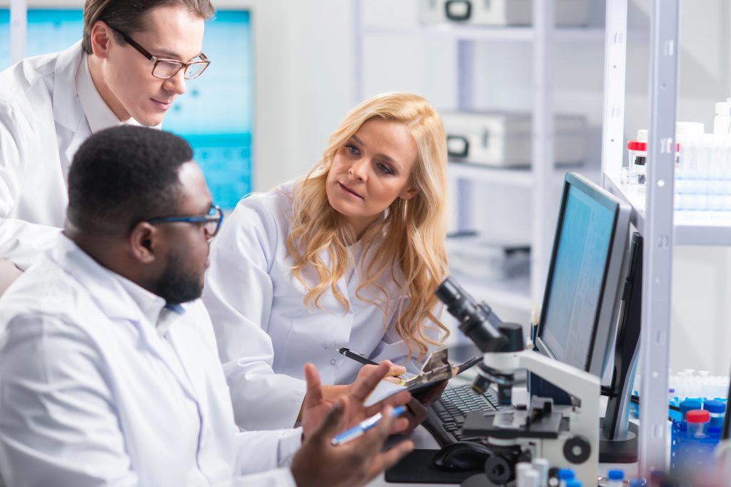 Professional team of scientists is working on a vaccine in a modern scientific research laboratory
